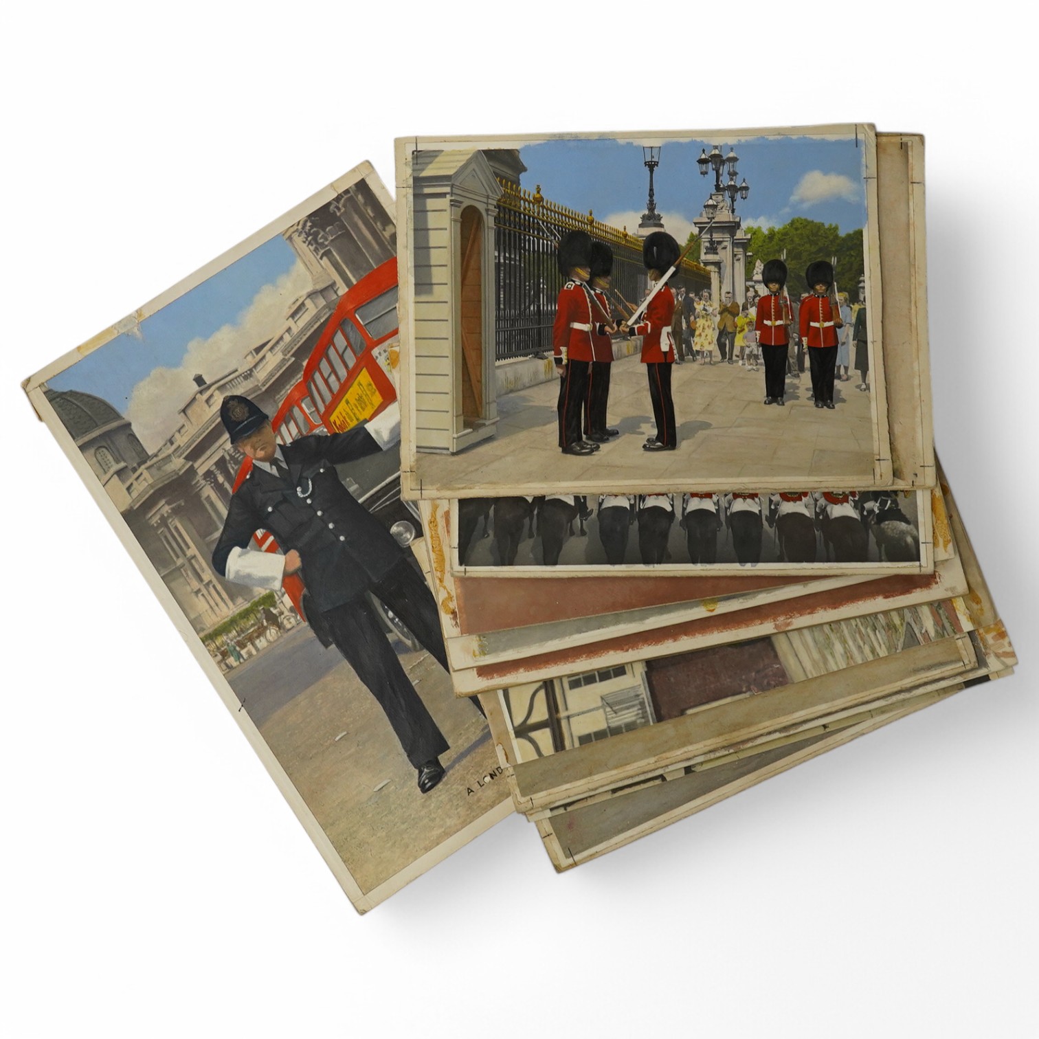 A set of thirteen original hand coloured photographs for postcards, London Pageantry scenes to include Changing the guard at Buckingham Palace, Lifeguards in the mall, London policeman and Yeoman warders at St James Pala